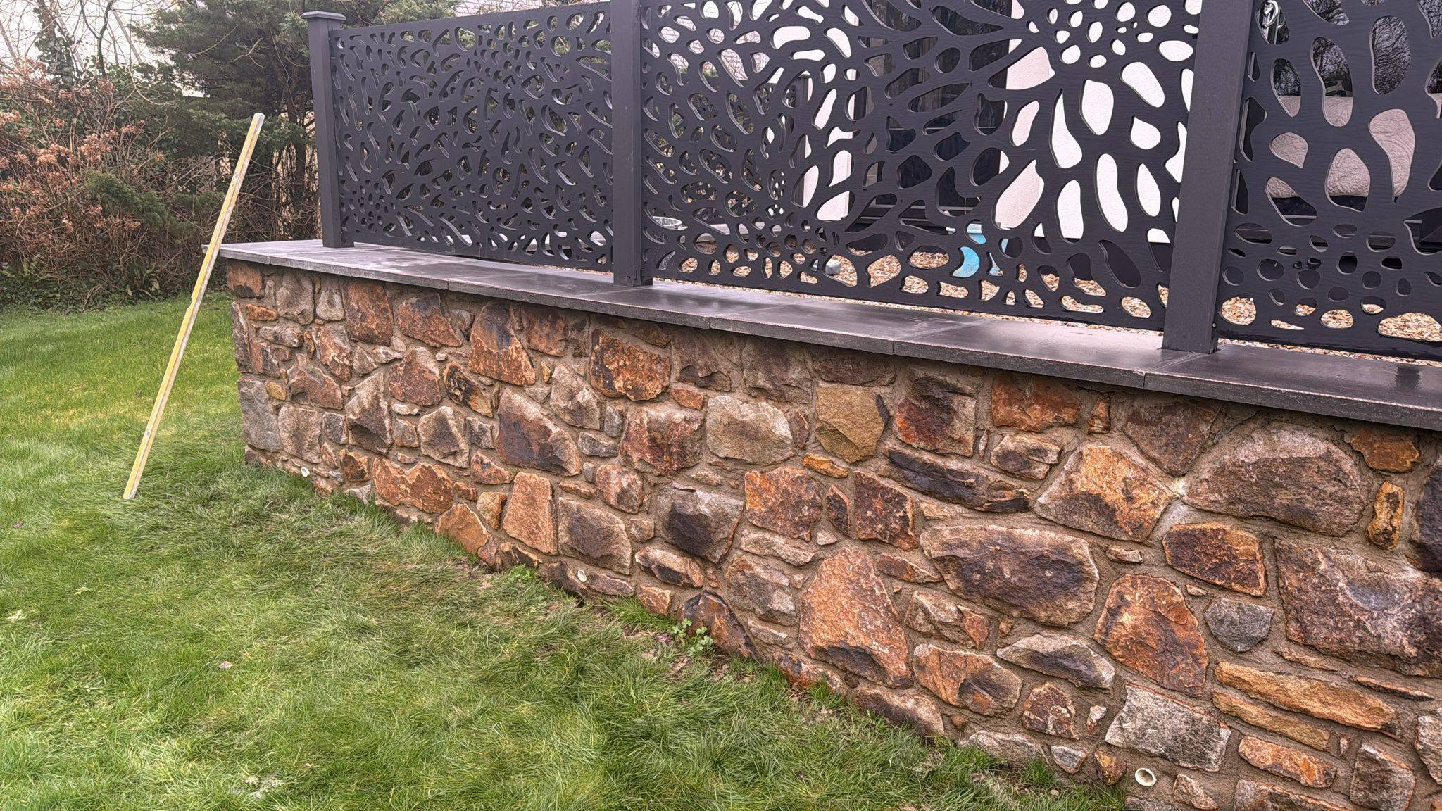 Natural stone wall with decorative screening North Wales